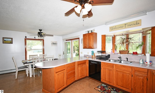 kitchen with sink, a textured ceiling, black dishwasher, kitchen peninsula, and ceiling fan