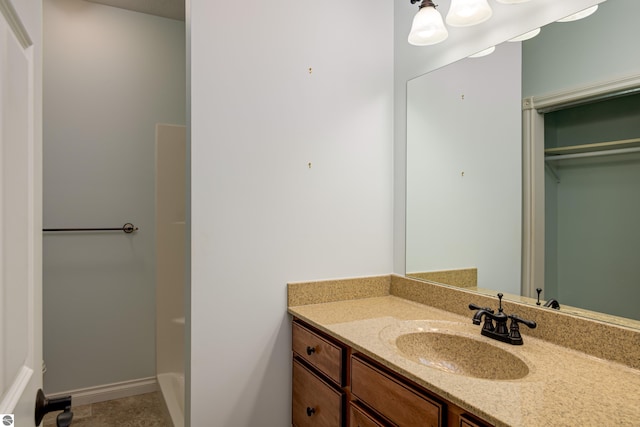 bathroom featuring vanity and baseboards