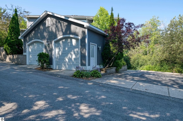 view of side of home with a garage