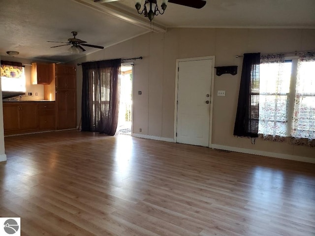 unfurnished living room featuring ceiling fan, hardwood / wood-style floors, and lofted ceiling