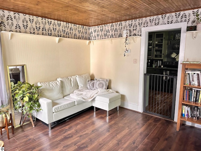 living room with dark hardwood / wood-style flooring and wood ceiling