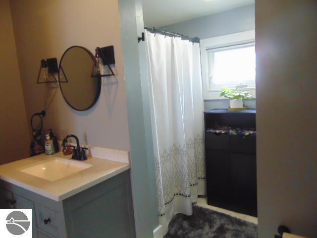 bathroom with vanity and walk in shower