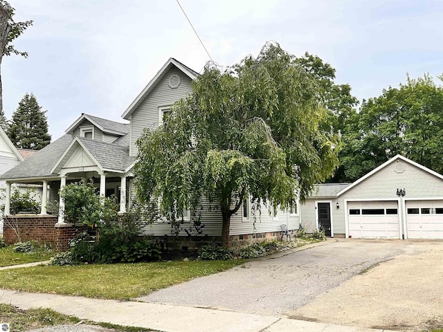 view of front of property with a front lawn and a garage