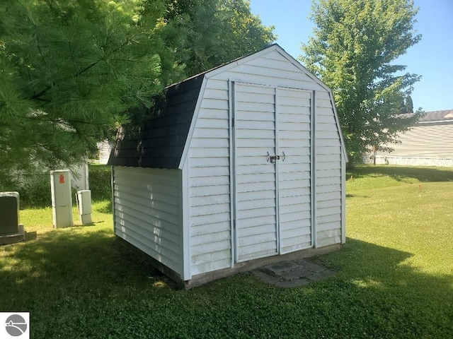 view of outdoor structure with a lawn