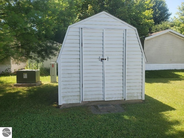 view of outdoor structure with a lawn