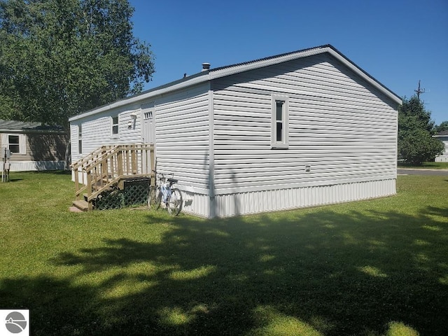 view of home's exterior with a yard