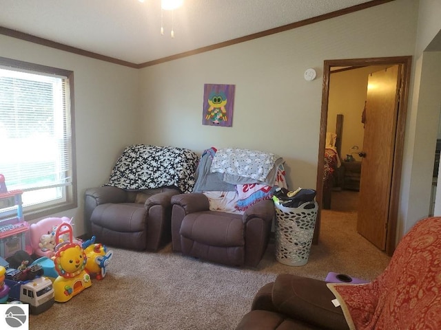 living room featuring carpet flooring, ornamental molding, and a healthy amount of sunlight