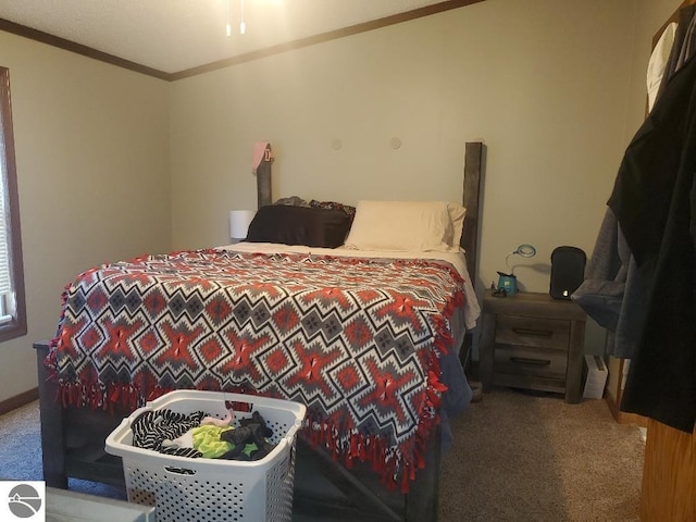 bedroom featuring carpet flooring and crown molding