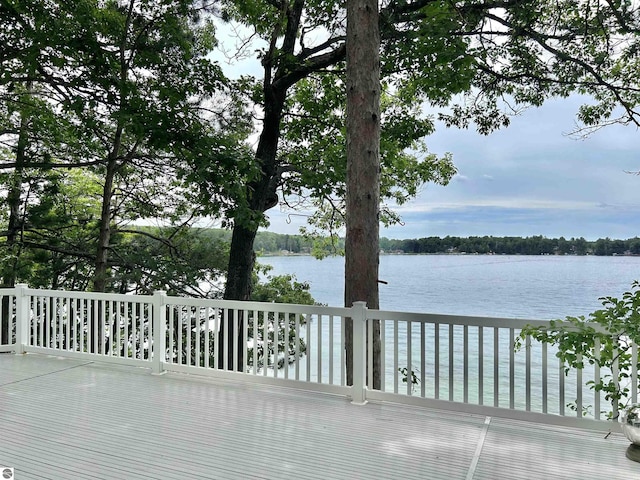 wooden deck with a water view