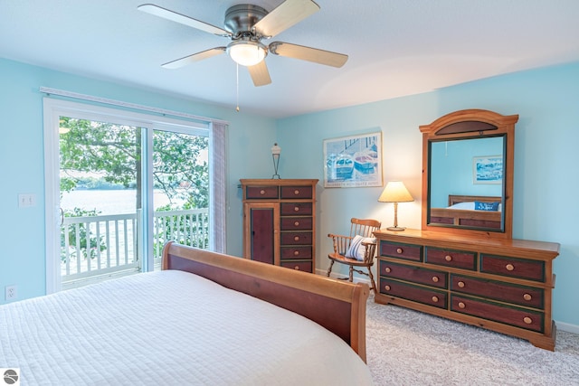 carpeted bedroom featuring access to outside and ceiling fan