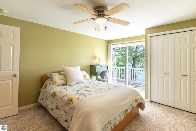 bedroom featuring light carpet, a closet, access to outside, and ceiling fan