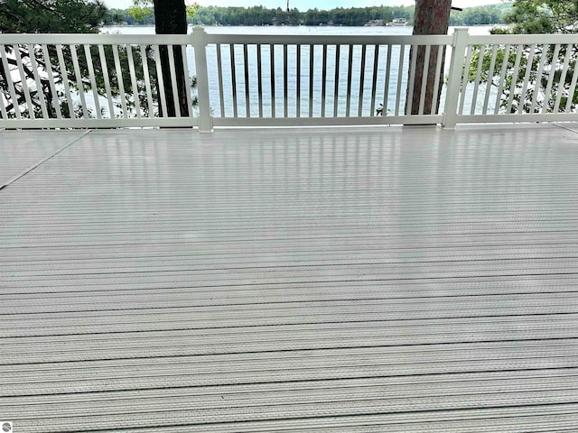 wooden deck featuring a water view