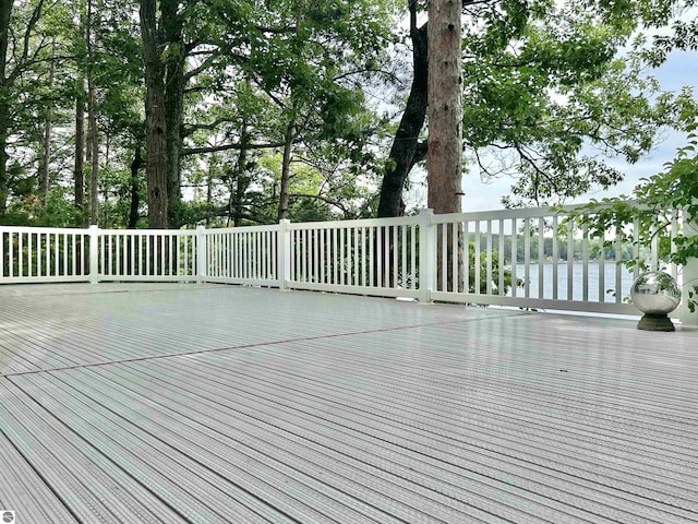 wooden terrace featuring a water view