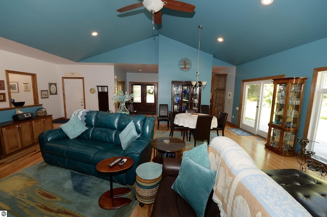 living room featuring high vaulted ceiling, ceiling fan, and hardwood / wood-style floors