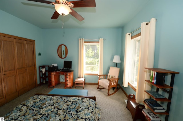 bedroom featuring carpet flooring, a closet, and ceiling fan