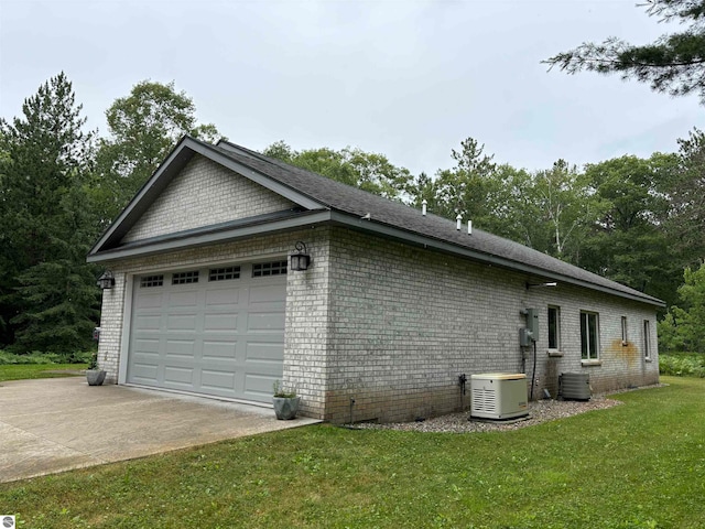 view of property exterior with a yard and central AC unit