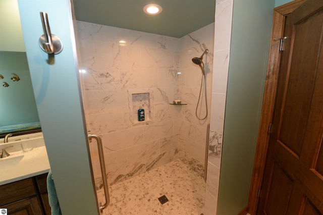 bathroom featuring vanity and a tile shower