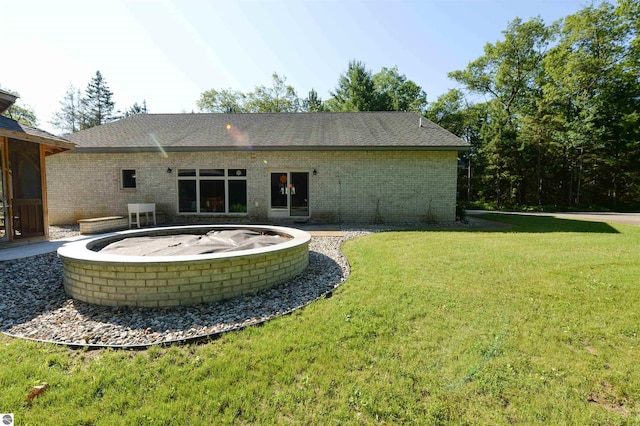 rear view of house with a patio area and a yard