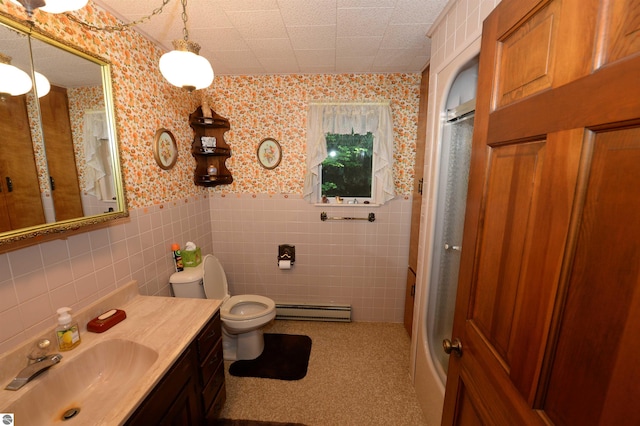 bathroom with vanity, tasteful backsplash, tile walls, a baseboard radiator, and toilet