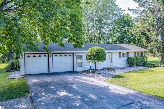 single story home with a front yard and a garage