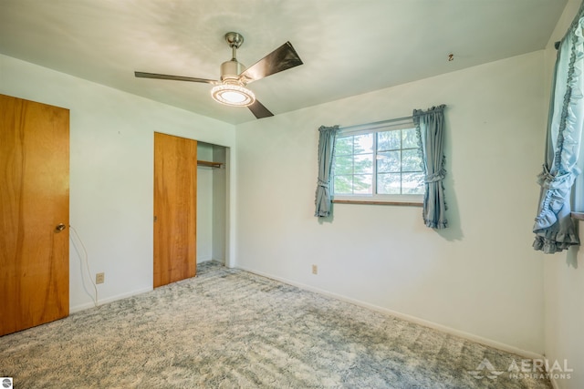 unfurnished bedroom featuring carpet flooring, a closet, and ceiling fan