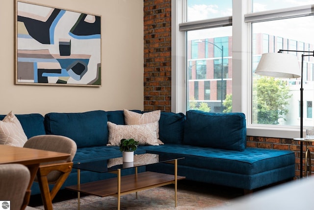 living room with brick wall