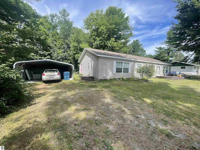 exterior space with a front lawn and a carport