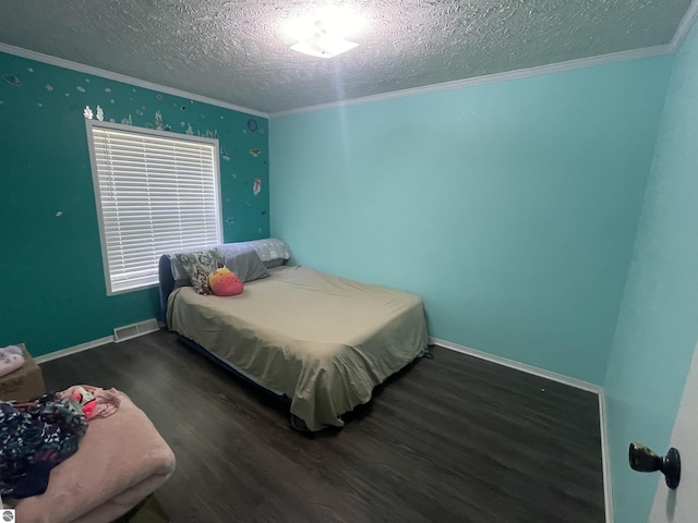 bedroom featuring a textured ceiling, crown molding, and dark wood-type flooring