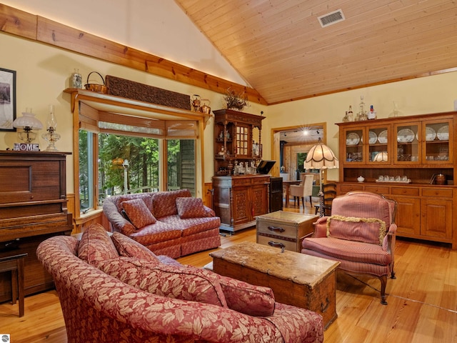 living room with wooden ceiling, high vaulted ceiling, and light hardwood / wood-style flooring