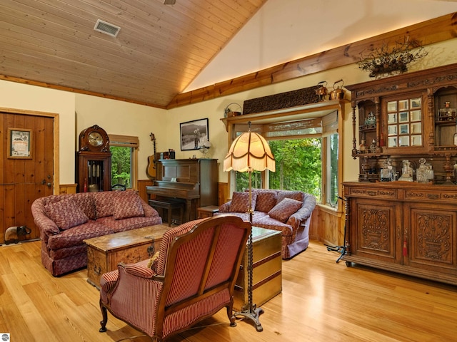 living room with lofted ceiling, wood walls, wooden ceiling, and light hardwood / wood-style flooring