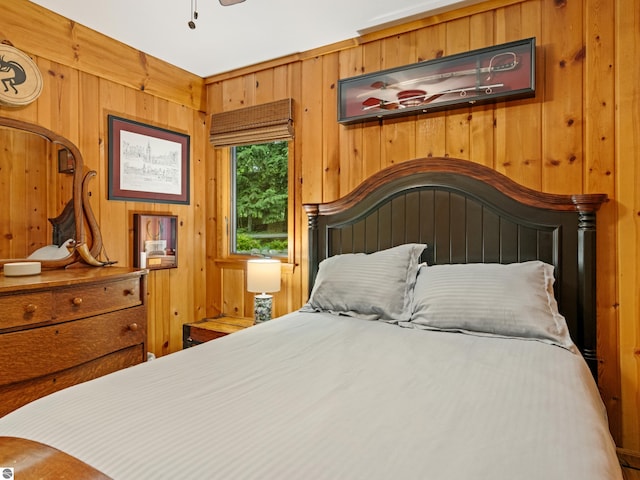 bedroom with wooden walls