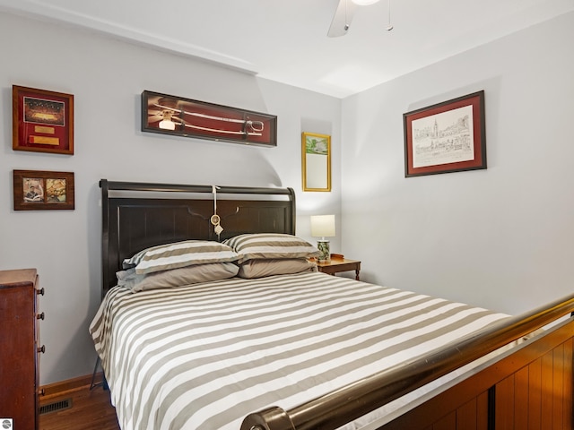 bedroom featuring ceiling fan and dark wood-type flooring