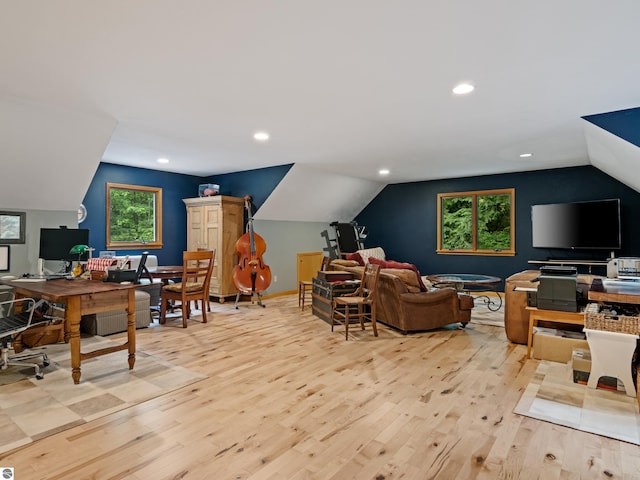 office area featuring lofted ceiling and light wood-type flooring