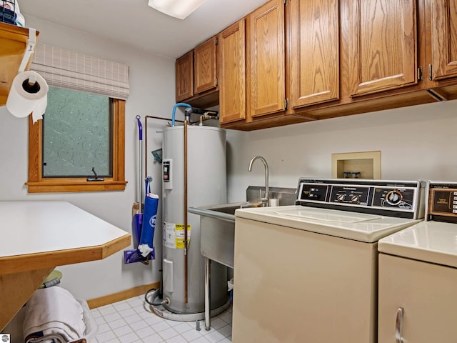 washroom featuring water heater, light tile patterned floors, cabinets, and independent washer and dryer