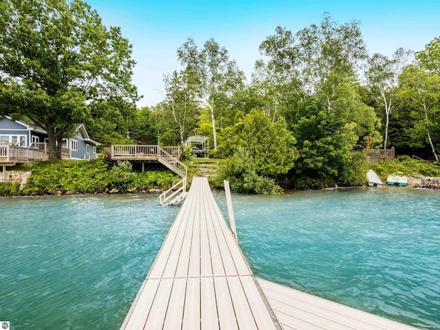 view of dock featuring a deck with water view