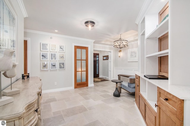 interior space with french doors, an inviting chandelier, and ornamental molding