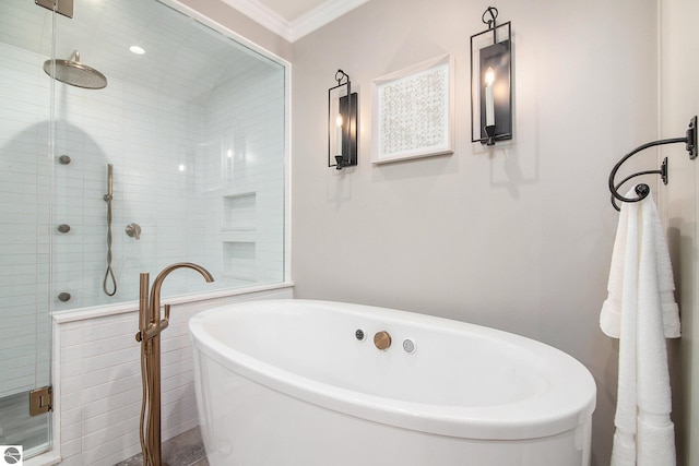 bathroom featuring crown molding and plus walk in shower