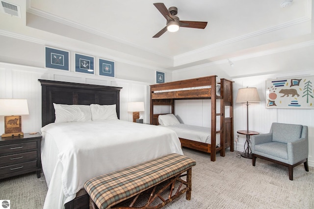 carpeted bedroom with ceiling fan and ornamental molding