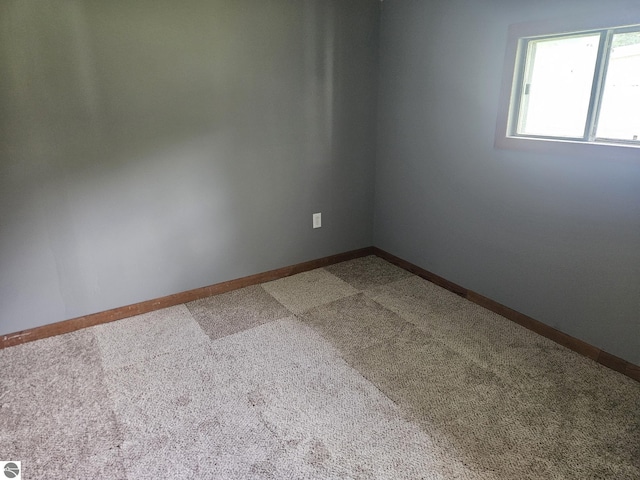 empty room with carpet flooring