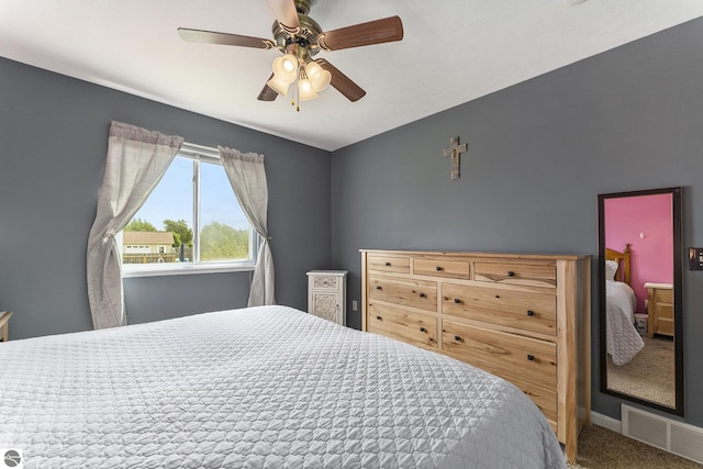 bedroom featuring ceiling fan and carpet floors