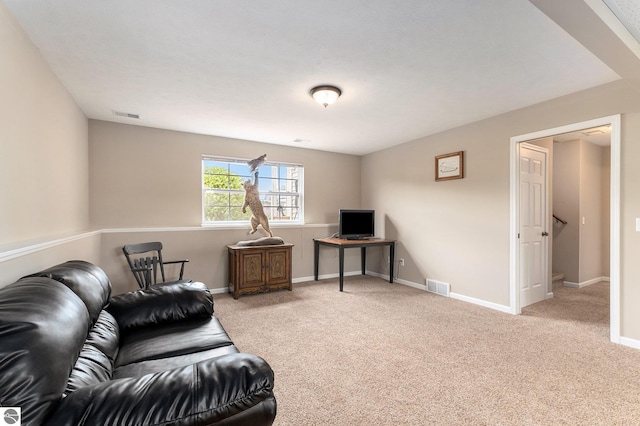 living area with light colored carpet