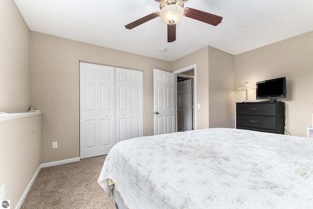 carpeted bedroom featuring a closet and ceiling fan