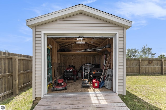 view of outbuilding with a yard