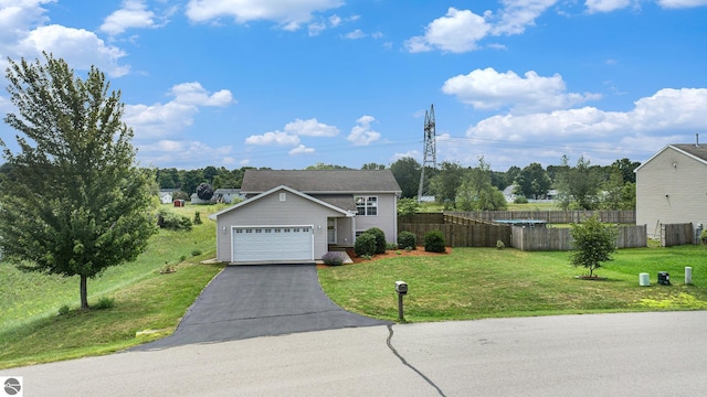 view of front facade with a garage and a front lawn