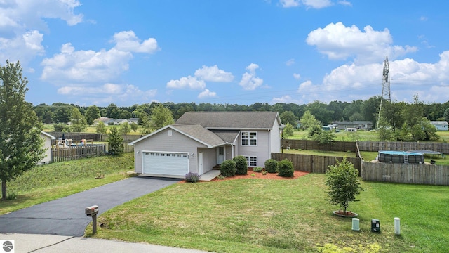 view of front facade featuring a garage and a front yard