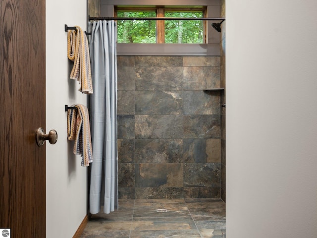 bathroom with a shower with curtain