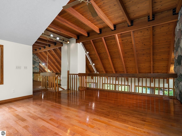 interior space with ceiling fan, hardwood / wood-style floors, and wood ceiling