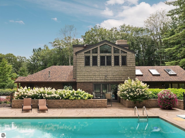 rear view of property featuring a patio