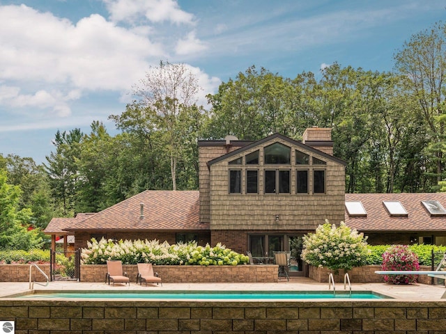 rear view of property with a patio area