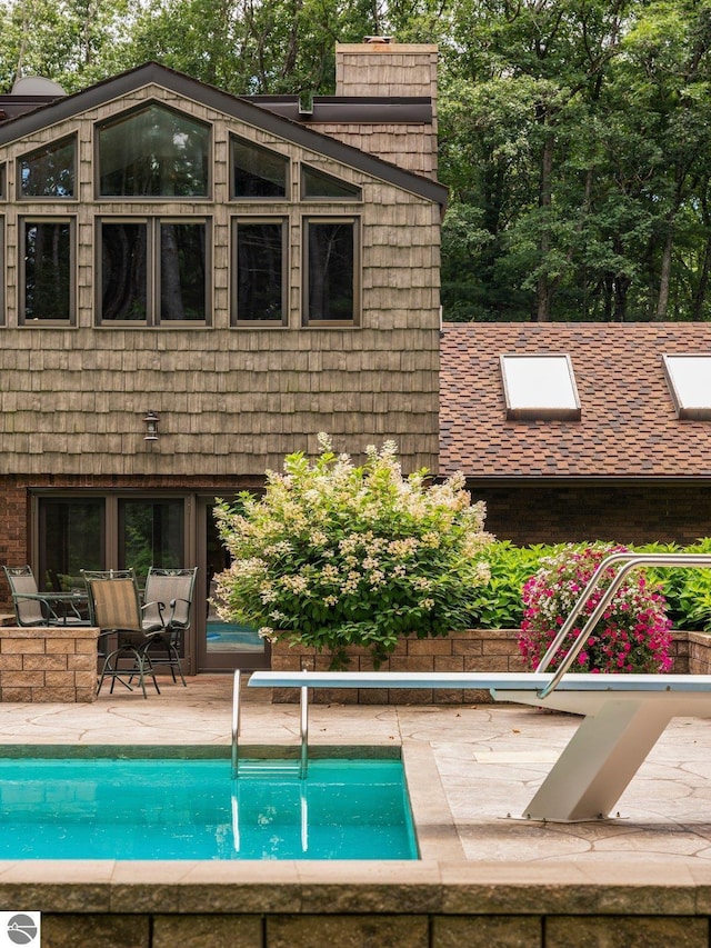 view of swimming pool featuring a patio area